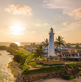 View of Galle Fort ramparts overlooking the Indian Ocean, with colonial-era buildings and cobblestone streets in southern Sri Lanka.