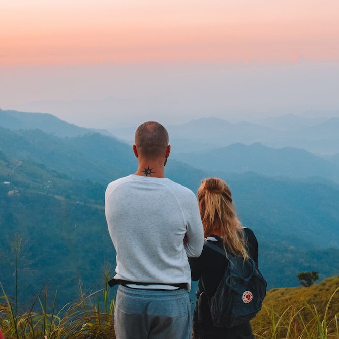 Travelers watching sunrise from the summit of Adam’s Peak in Sri Lanka.